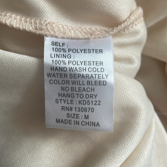 Katia Dress with pleats and cutouts - Picture 15 of 15